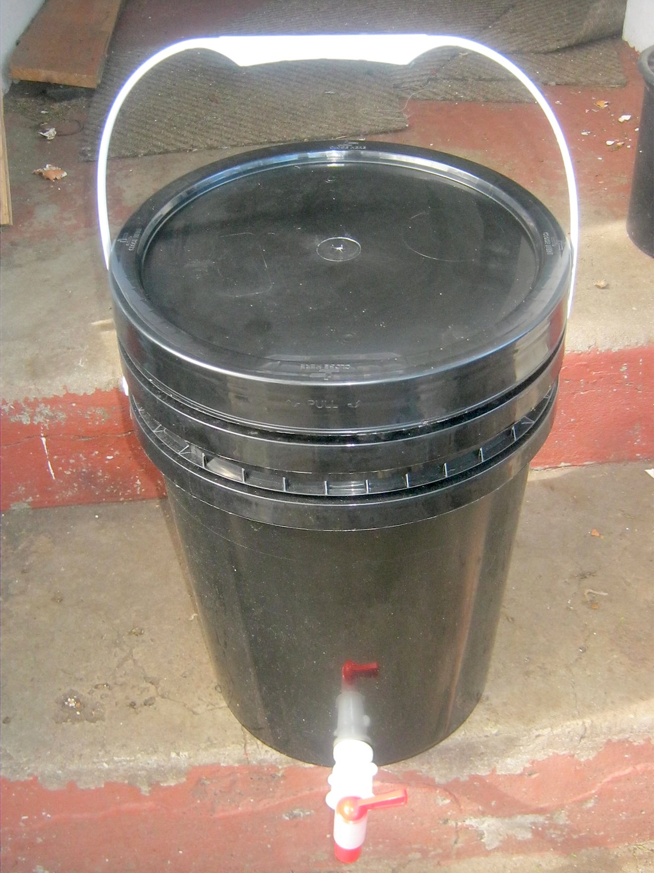 Fully functional DIY worm composting bin consisting of 2 buckets,with ventilation holes, lid and tap.