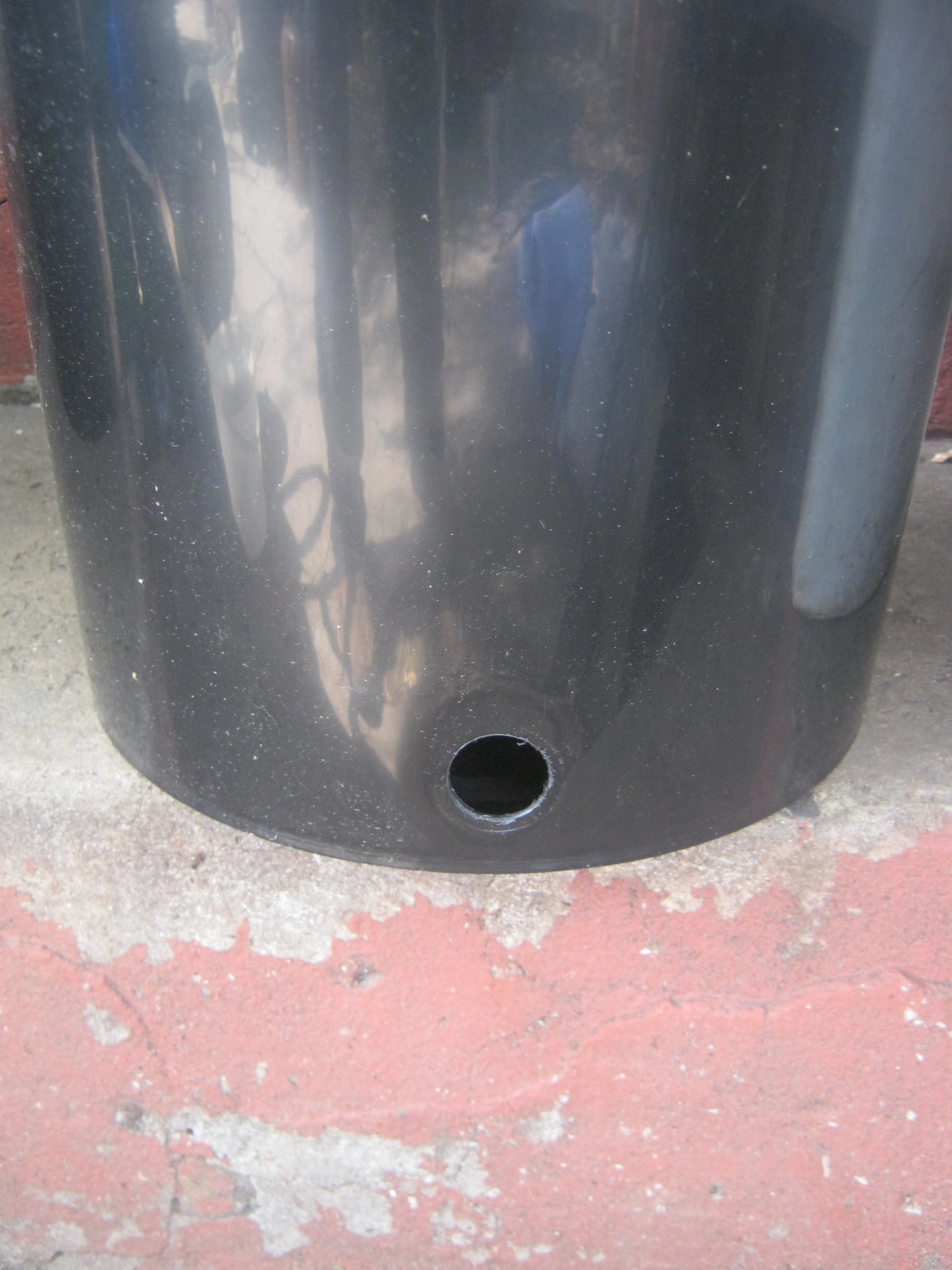 Collecting bin of worm farm with hole for tap